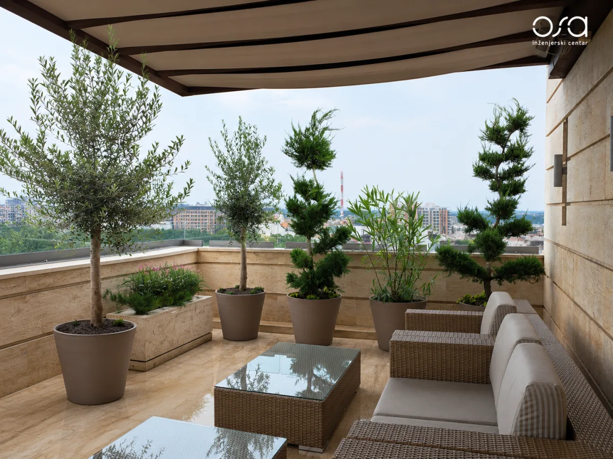 Finished terrace at OSA Engineering Center with olive trees and seating